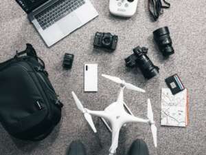a laptop and mobile phones on the floor